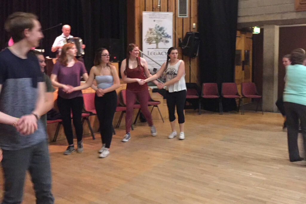 Doing my best to follow the instructor’s steps, I got to dance at my first Irish Céilí? (a traditional Irish social gathering). (I’m the one in the maroon outfit.)